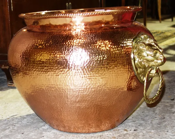 A beaten copper and brass lion mask mounted jardiniere.