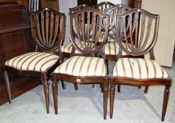 A set of six mahogany shield back dining chairs. (6)
