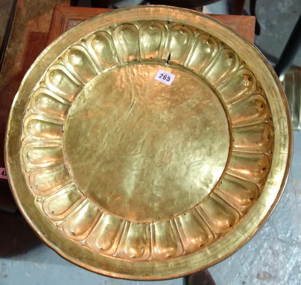 A gilded copper charger, possibly 17th century.
