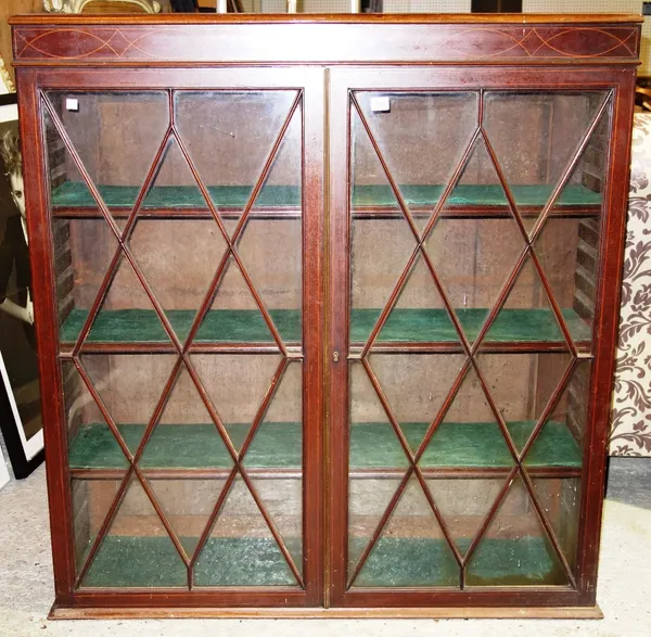 An inlaid mahogany two door display cabinet.