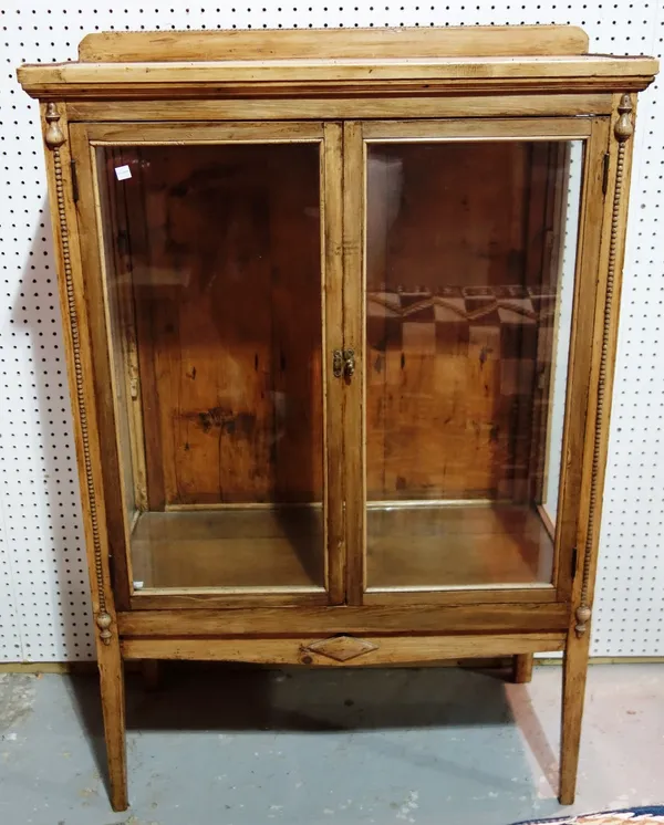 A 19th century pine two door glazed display cabinet.