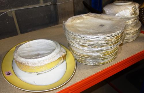 A Limoges part dinner service with yellow borders. (qty)