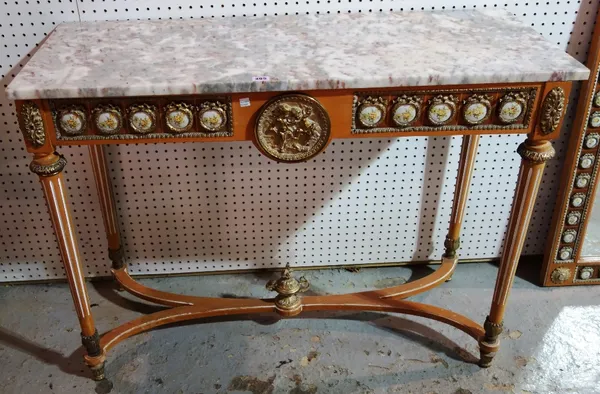 A 20th century marble top console table with gilt metal mounted ceramic plaque decoration.