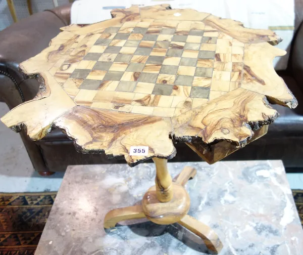 A 20th century naturalistic chess top tripod table.