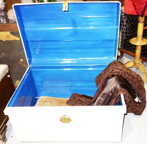 A white painted tin travelling trunk and a fur coat. (2)
