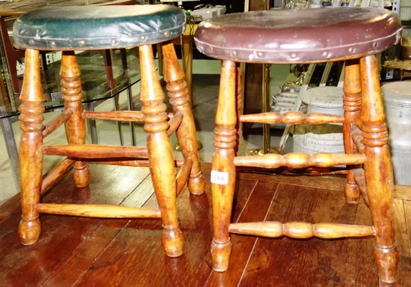 A pair of oval top stained beech stools. (2)