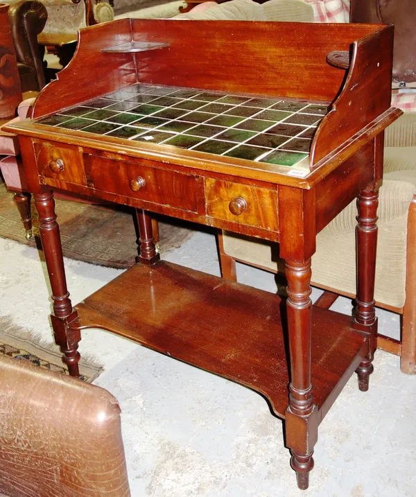 A 19th century mahogany washstand with 3/4 galleried back and inset tile top.
