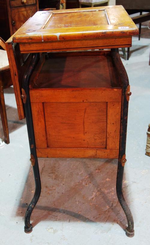 A 20th century oak and metal folding table.