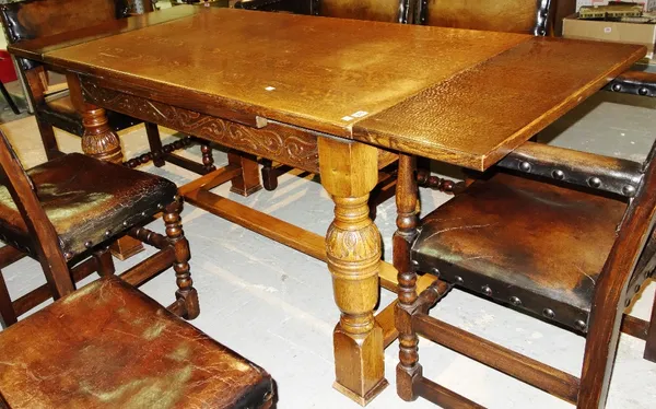 A 20th century oak extending drawer leaf dining table