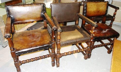 A set of six 20th century oak and leather dining chairs, together with a similar pair. (8)