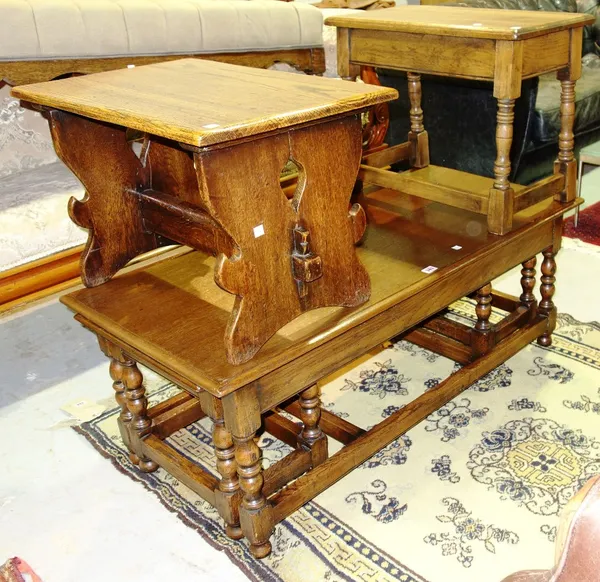 A 20th century oak nest of three tables, a 20th century oak side table and another side table (5).