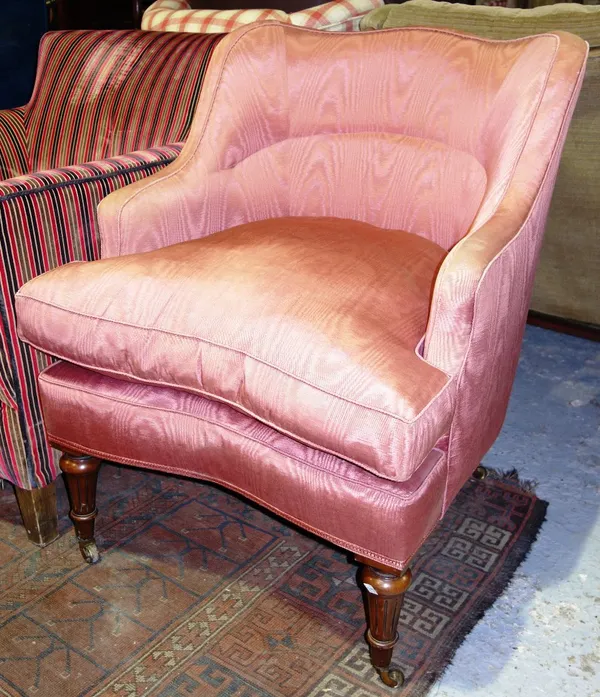 A pink upholstered walnut framed armchair.