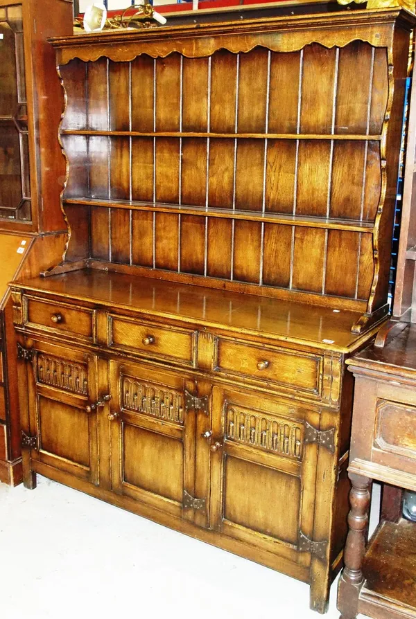 A 20th century oak kitchen dresser.