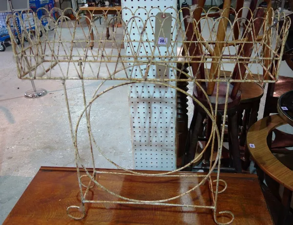 A white painted Victorian wire work planter.