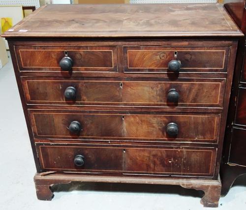 A 19th century mahogany and inlaid chest of two short and three long drawers.