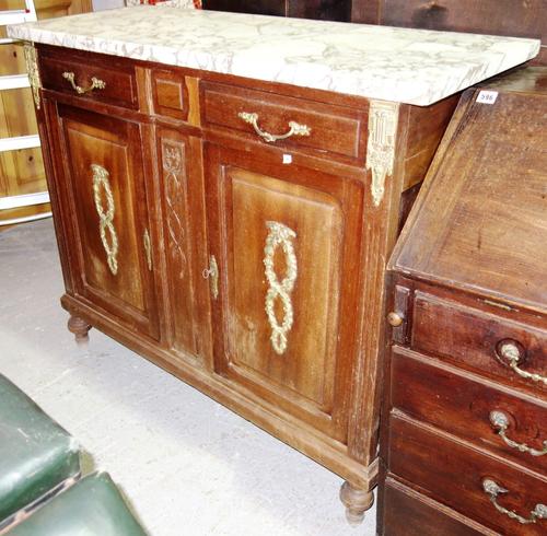 A walnut and gilt metal mounted side cabinet with white marble top.