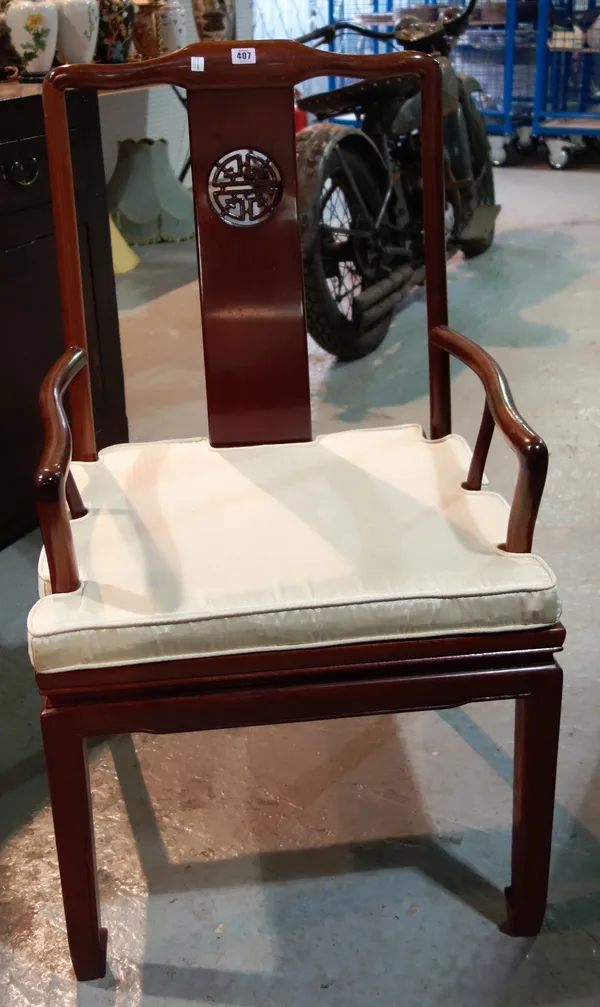 A pair of 20th century Oriental hardwood open armchairs. (2)