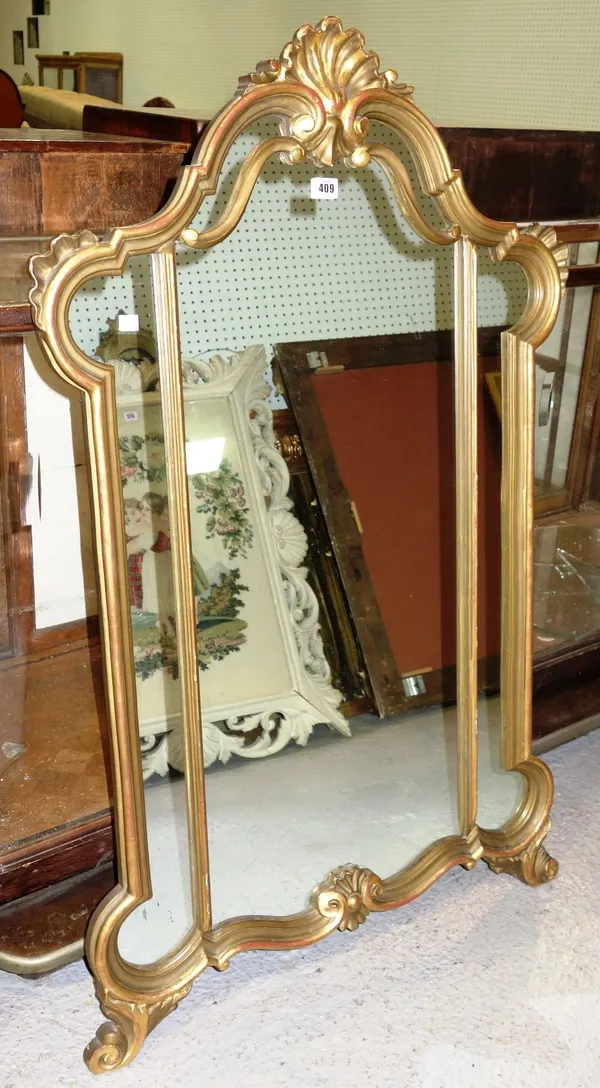 A 20th century gilt wall mirror with shell surmount.
