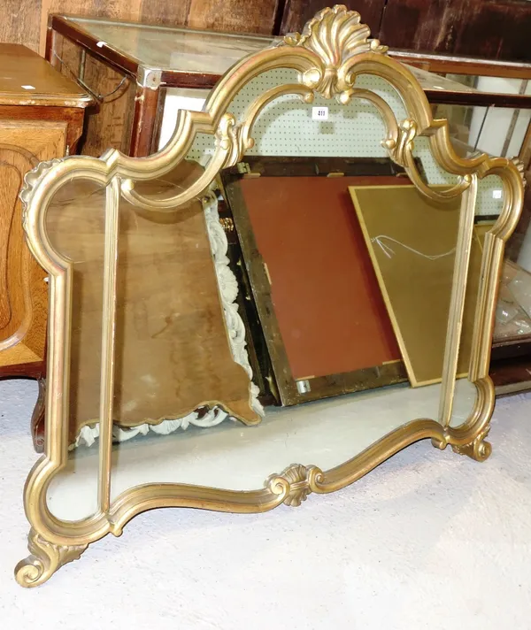 A gilt framed overmantel mirror with shell carved surmount.