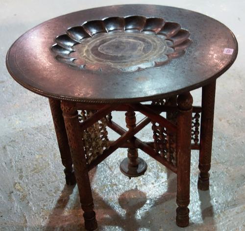 A hardwood and brass folding tray table.