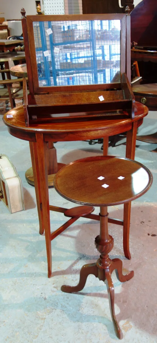An oval mahogany occasional table, a mahogany wine table, a toilet mirror and a book trough. (4)