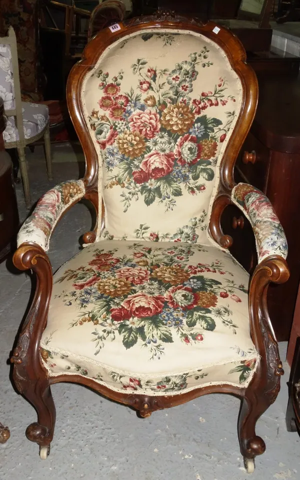 A 19th century mahogany spoon back upholstered armchair.