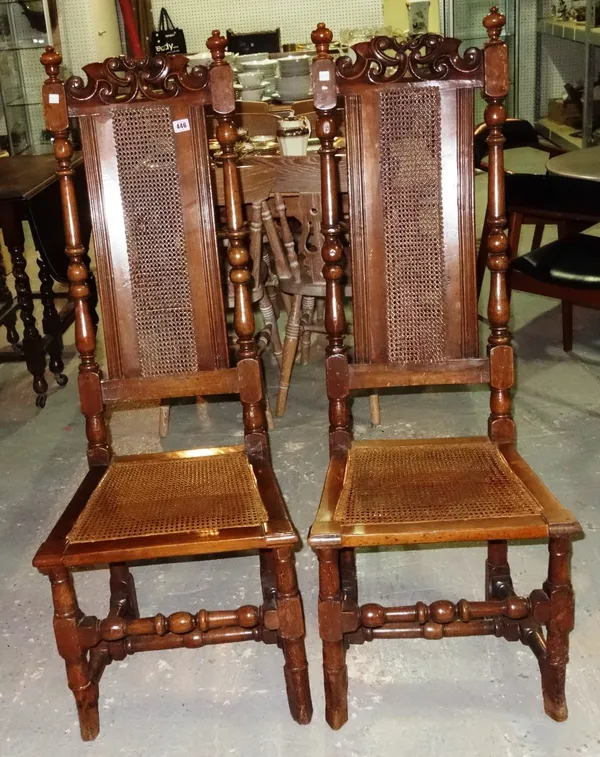 A pair of 17th century style walnut framed high back armchairs with turned supports. (2)