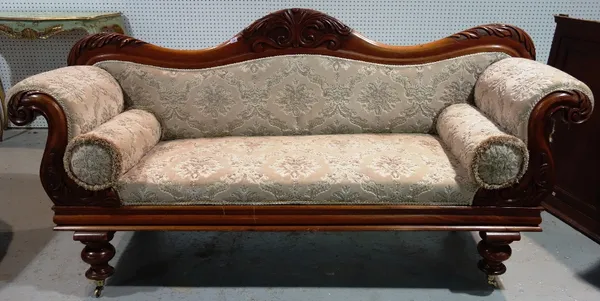 A William IV mahogany framed sofa with roll over arms and turned front supports, 211cm wide.