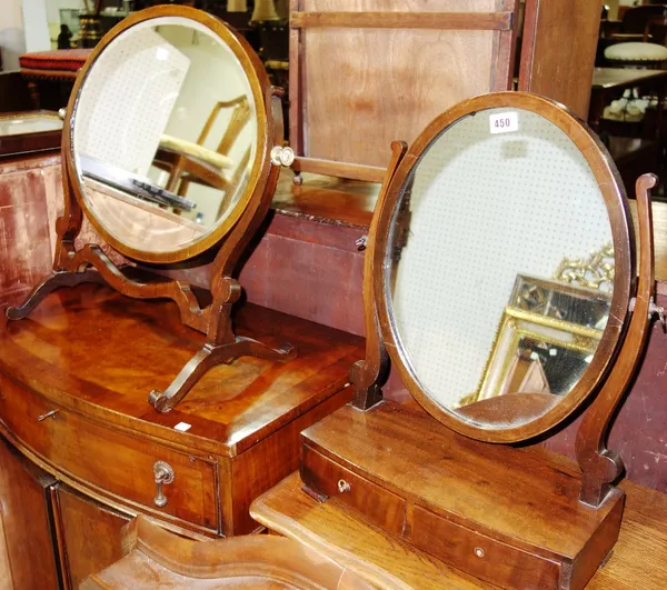 A mahogany oval two drawer toilet mirror and another toilet mirror. (2)