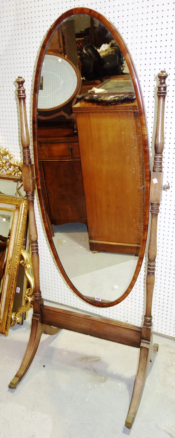 A 19th century mahogany oval cheval mirror.