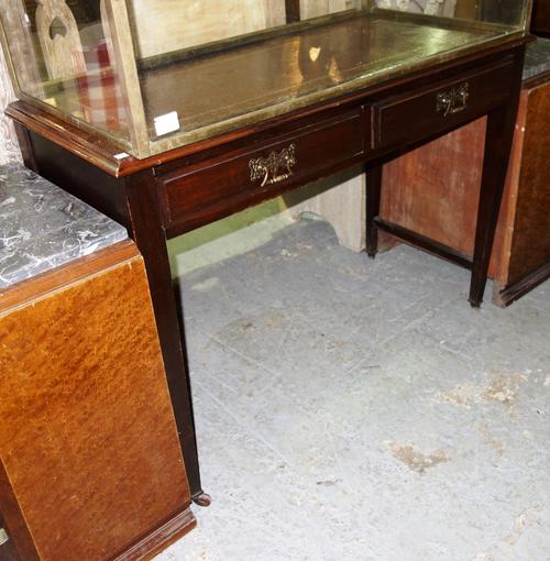 A 19th century mahogany and green leather topped two drawer writing table.