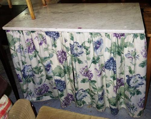 A mahogany two drawer side table with marble top.