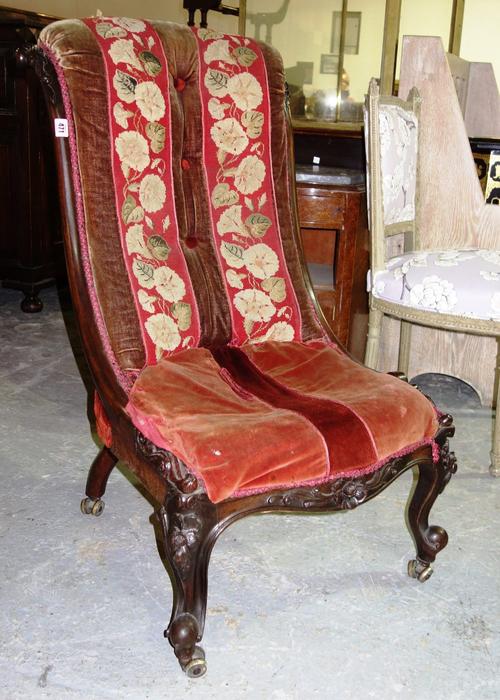 A Victorian mahogany scroll back nursing chair.
