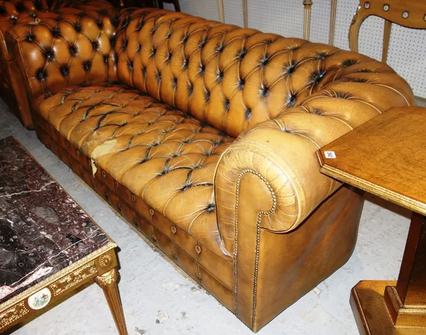 A 20th century brown leather Chesterfield sofa.
