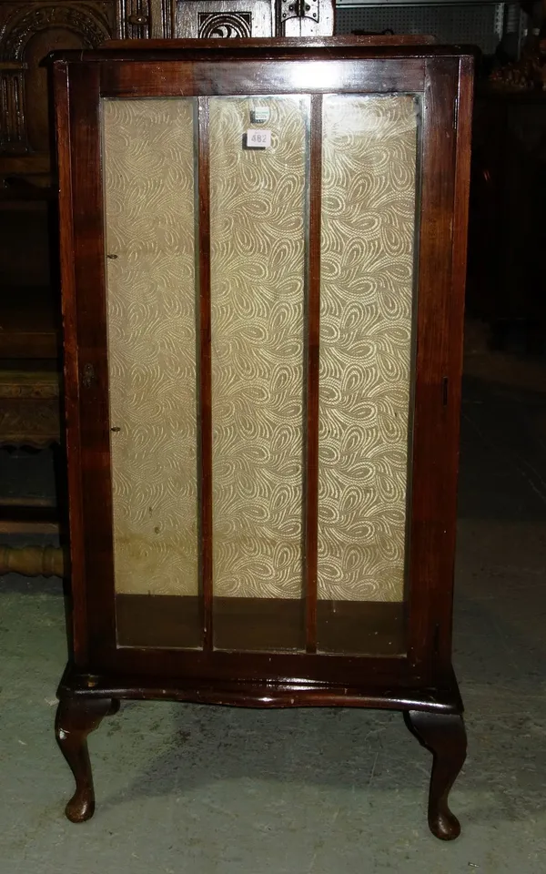 A 20th century stained mahogany glazed display cabinet.