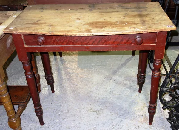 A 19th century stained pine bowfront single drawer side table.