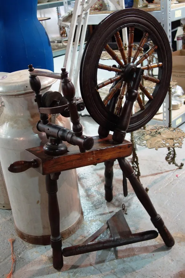 A 19th century spinning wheel.