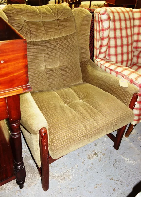 A 20th century walnut framed wing armchair.