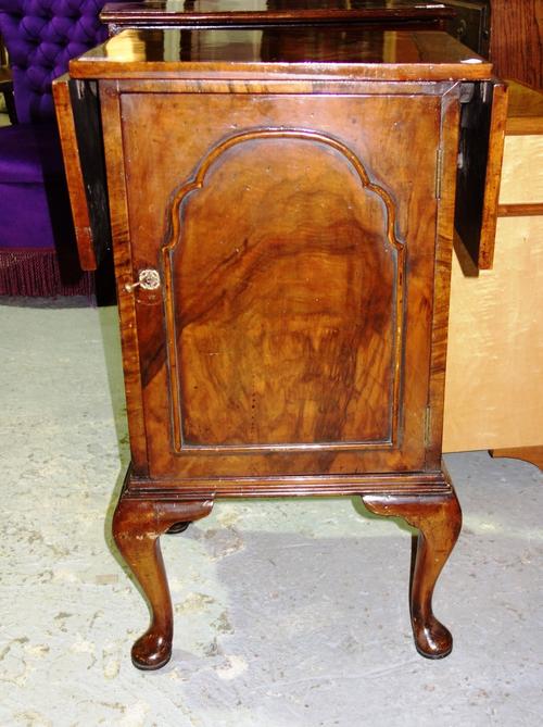 A walnut drop flap pot cupboard.