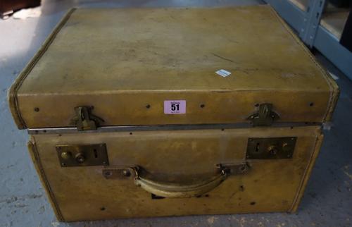 A quantity of collectables including candlesticks, wall lights and sundry contained in a vellum suitcase.  (qty)