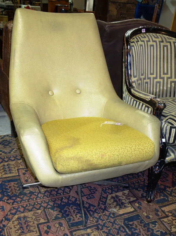 A 20th century green leather button swivel chair.