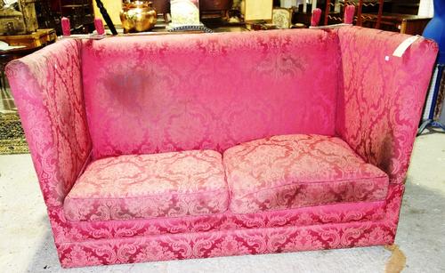 A 20th century Knole style burgundy upholstered drop end sofa.