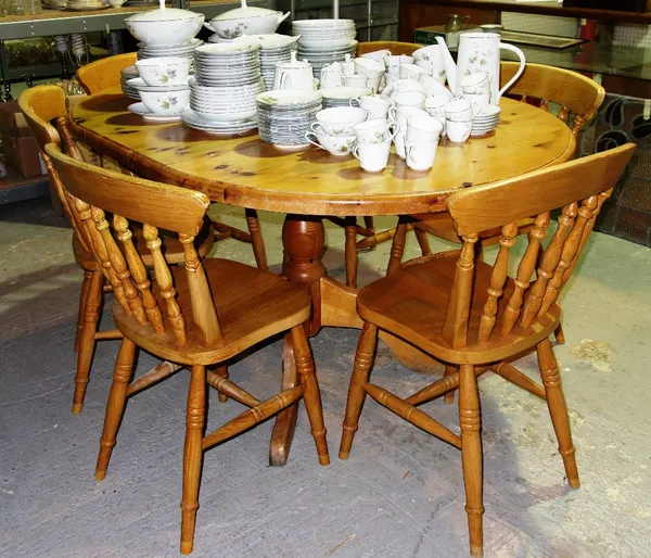 A 20th century pine extending dining table, together with six chairs.