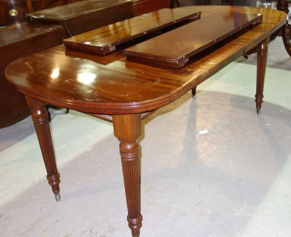 A 19th century mahogany extending dining table.