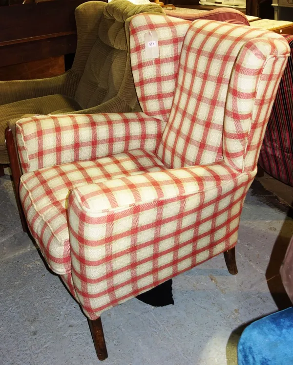 A 20th century chequered upholstered armchair.