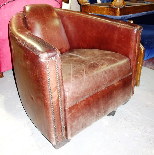 A 20th century brown leather armchair.