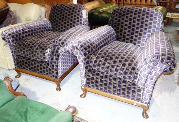 A pair of walnut framed purple upholstered armchairs. (2)