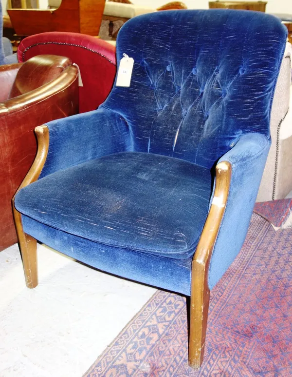 A 20th century Parker Knoll blue velvet button back chair.