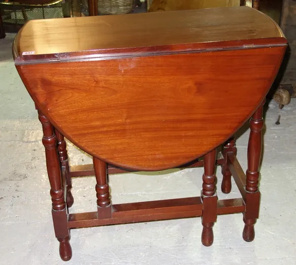 A mahogany gate leg dining table.