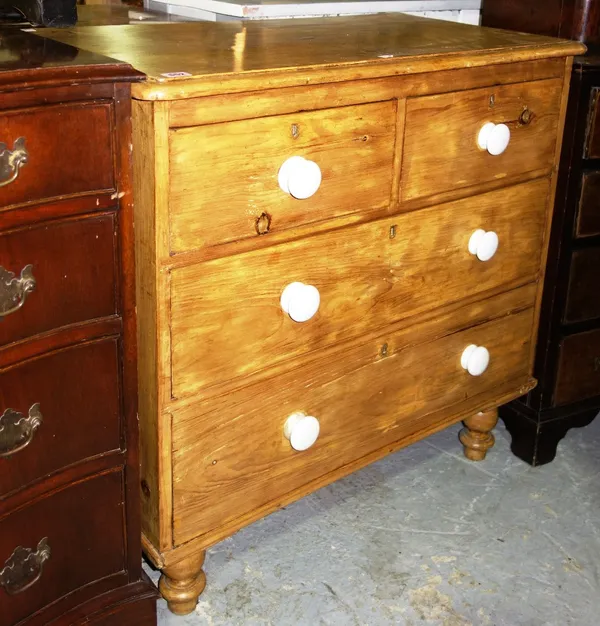A Victorian pine chest of two short and two long drawers, on turned feet.